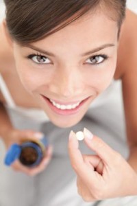 Vitamin E for skin Woman Taking Vitamin