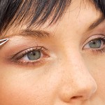 Choosing The Right Tweezers Woman Tweezing Eyebrows Feature
