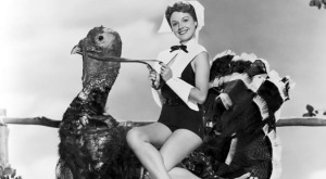 Happy Thanksgiving 1950s woman on turkey