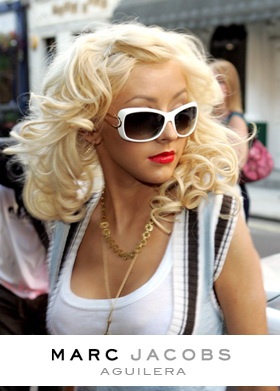 Christina Aguilera in Marc Jacobs sunglasses with a wild curly blonde bombshell hairstyle