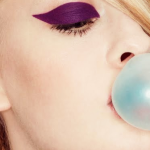 chewing gum fashion week model purple eyeshadow blue gum