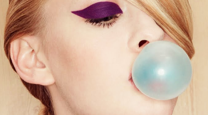 chewing gum fashion week model purple eyeshadow blue gum