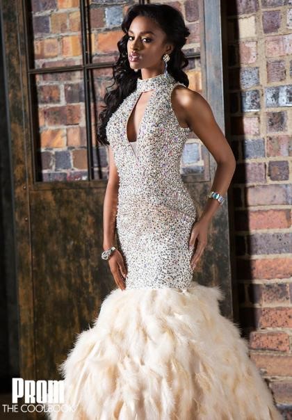 black girl in cutout mermaid sequin prom dress with feathers