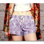 Woman with midriff and drawstring bohemian elephant shorts