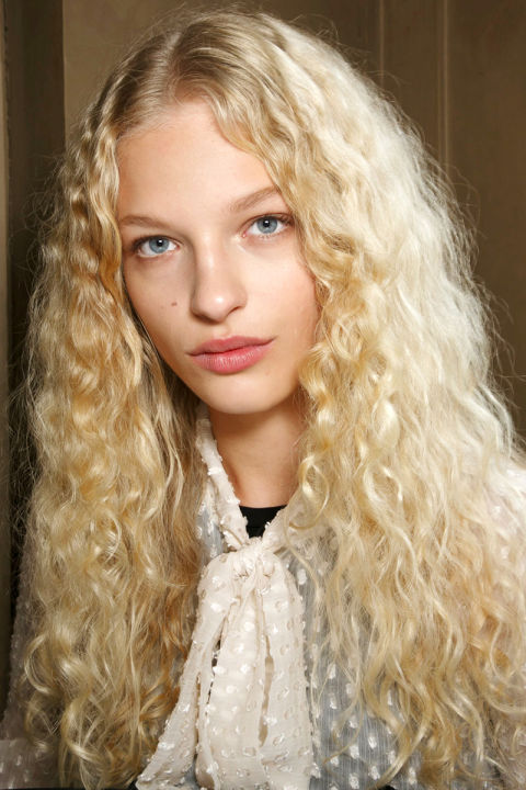 Blonde Unstyled Curls Curly Hair on Blonde Model with cream tied top