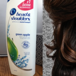 head-and-shoulders shampoo next to brunette woman