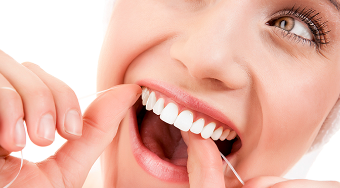 dental woman flossing great teeth