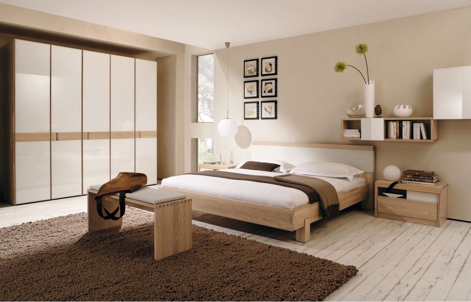 Modern contemporary natural wood bed frame in well lit calming spa style bedroom
