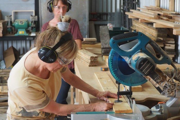 woman with miter saw