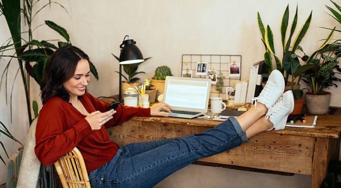 Brunette-woman-home-plants-laptop WFH