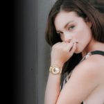 Woman wearing gold watch