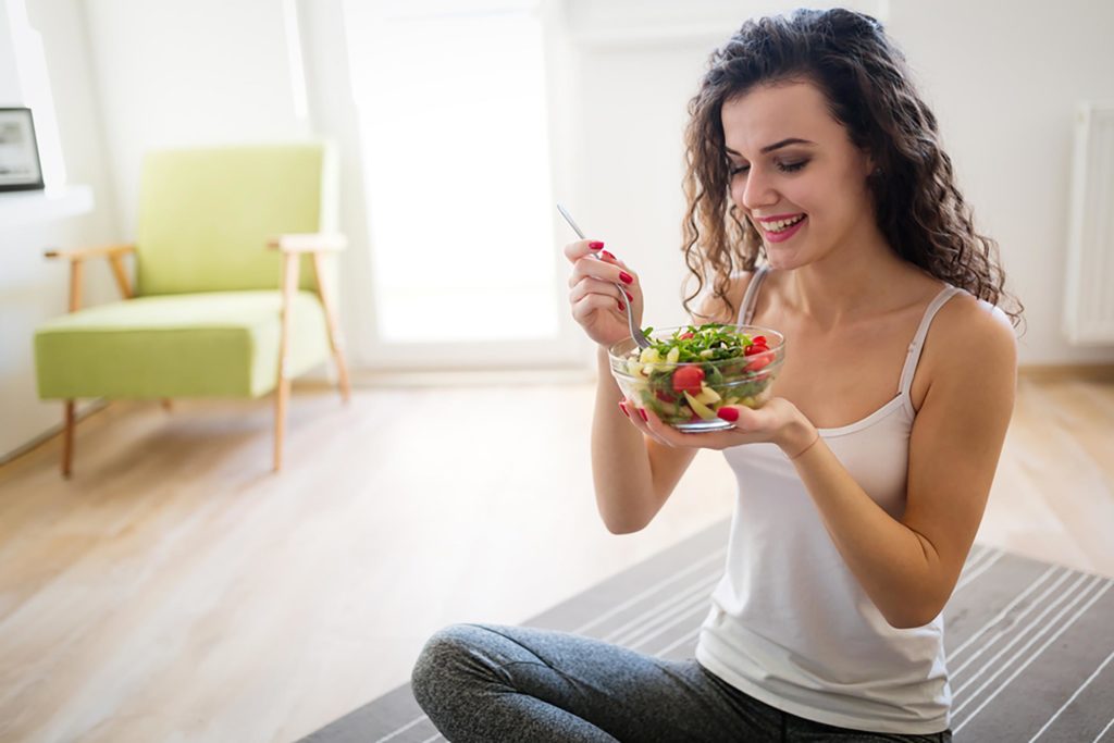 Health Diet Young Woman Eating Salad Smiling Curly Hair