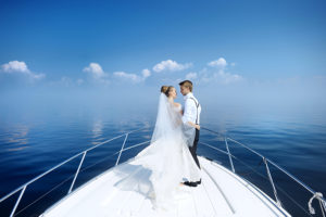 Yacht boat wedding Happy bride and groom on the bow of ship