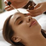 CBD skincare serum applying on woman