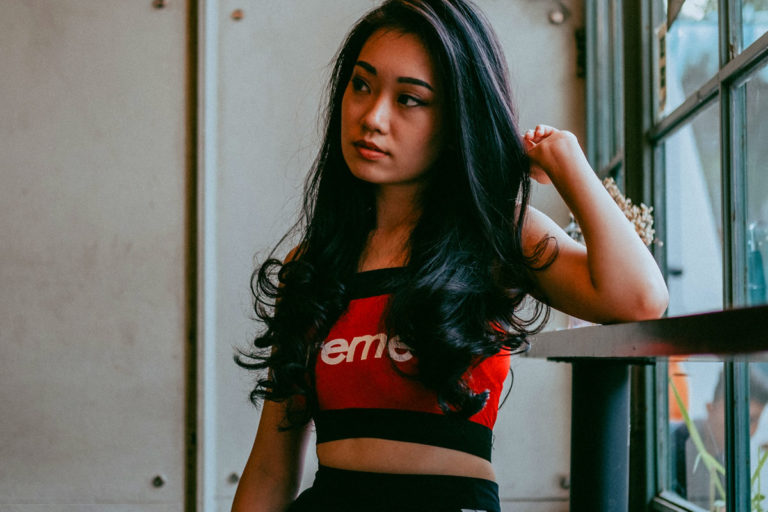 Woman Dark Hair Heat styling Flat ironing hair straightening