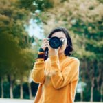 woman-photographing-with-camera-outside