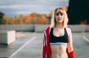 young blonde woman in sports bra Calvin Klein