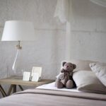 teddy bear on a bed bedroom women
