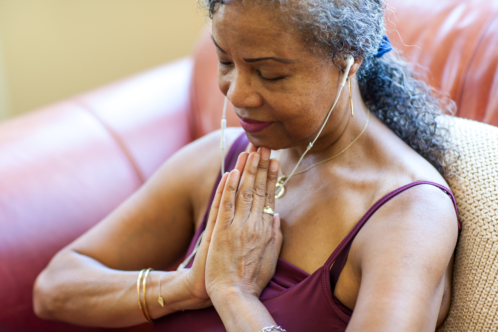 woman praying yoga meditation self care covid