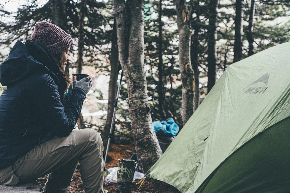 woman campsite tent cold