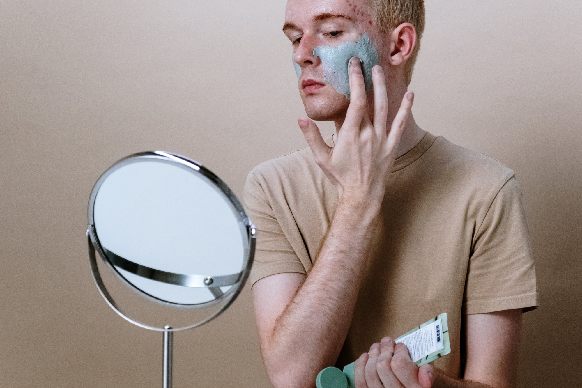diabetic demopathy redhead man putting on face mask skincare