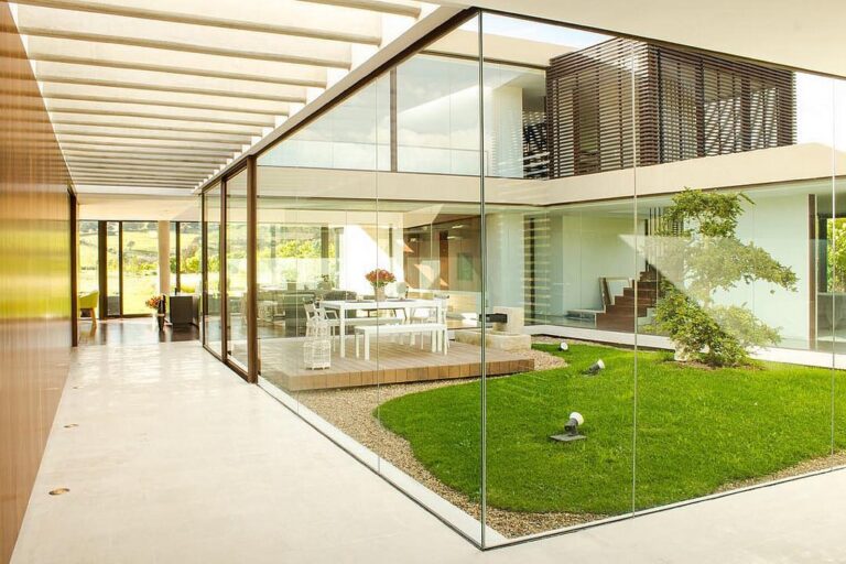 Modern green frameless glass windows patio
